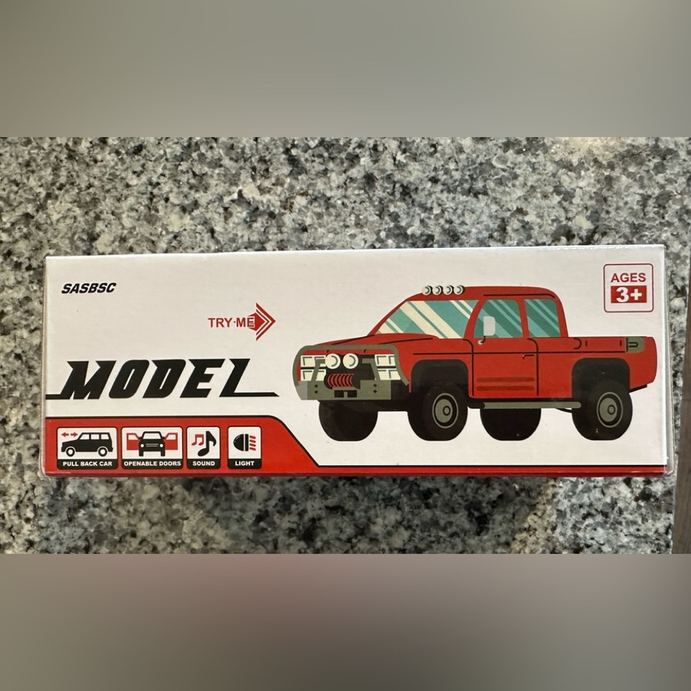 Pull Back Model Truck with lights, openable doors, sounds , and lights.